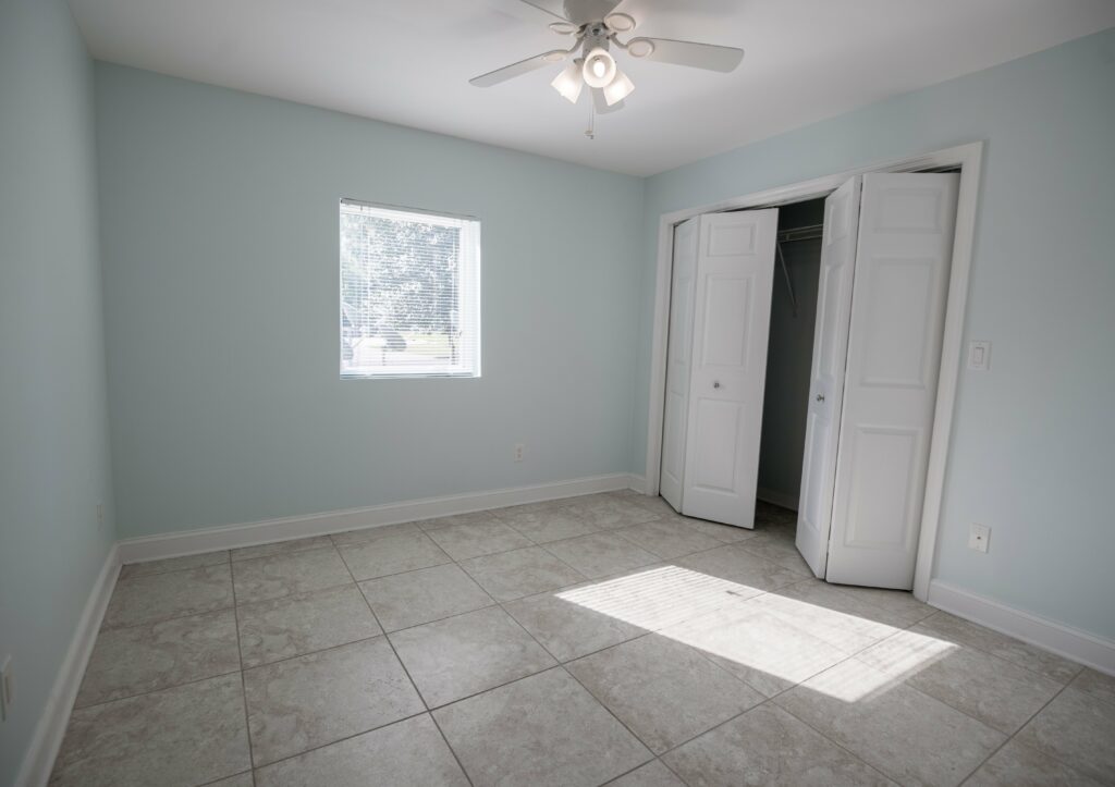 Photo Of Empty Room With Open Double Door Closet